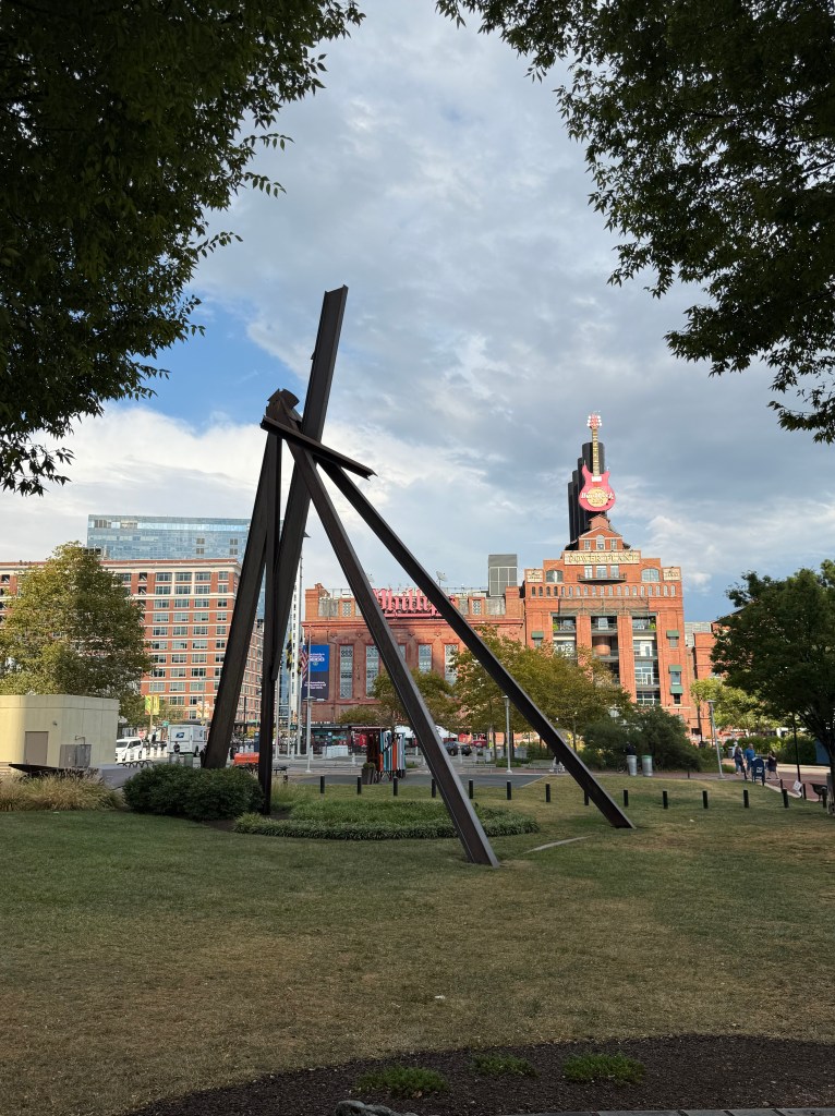 Under Sky/One Family Art Sculpture with Pratt Street Power Plant in the background